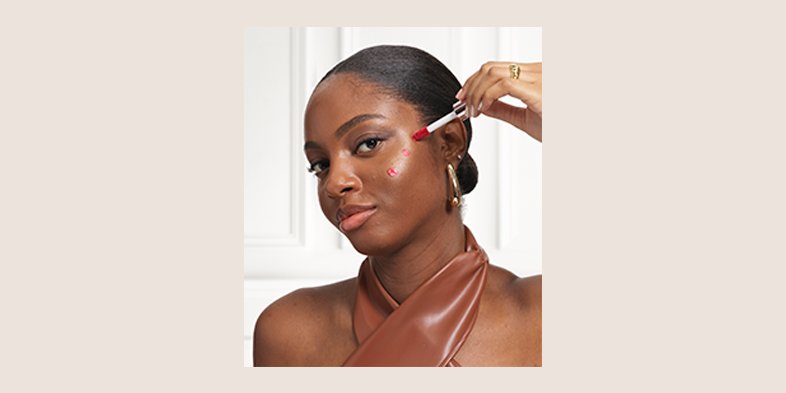 A woman with darker complexion using red blush